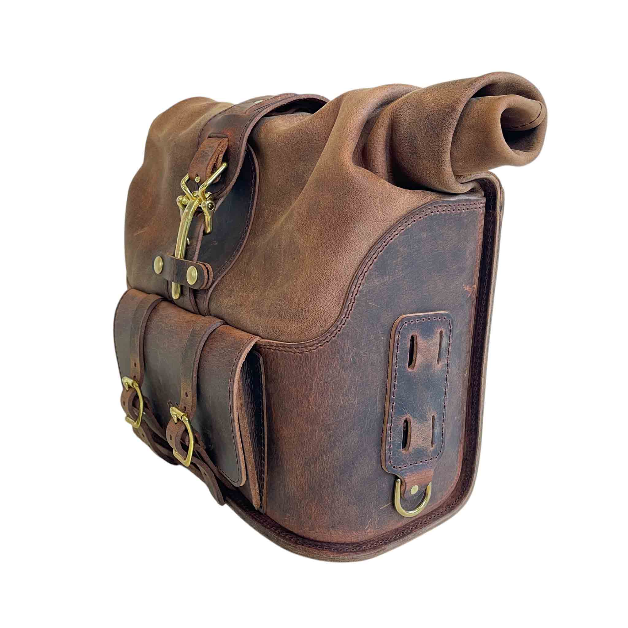 Triumph Bonneville Bobber Panniers Rolltop Swingarm Saddlebags. Hand crafted in USA with premium veg tan water buffalo leather, waterproof liners and solid brass hardware. BAD&G Customs TBP01