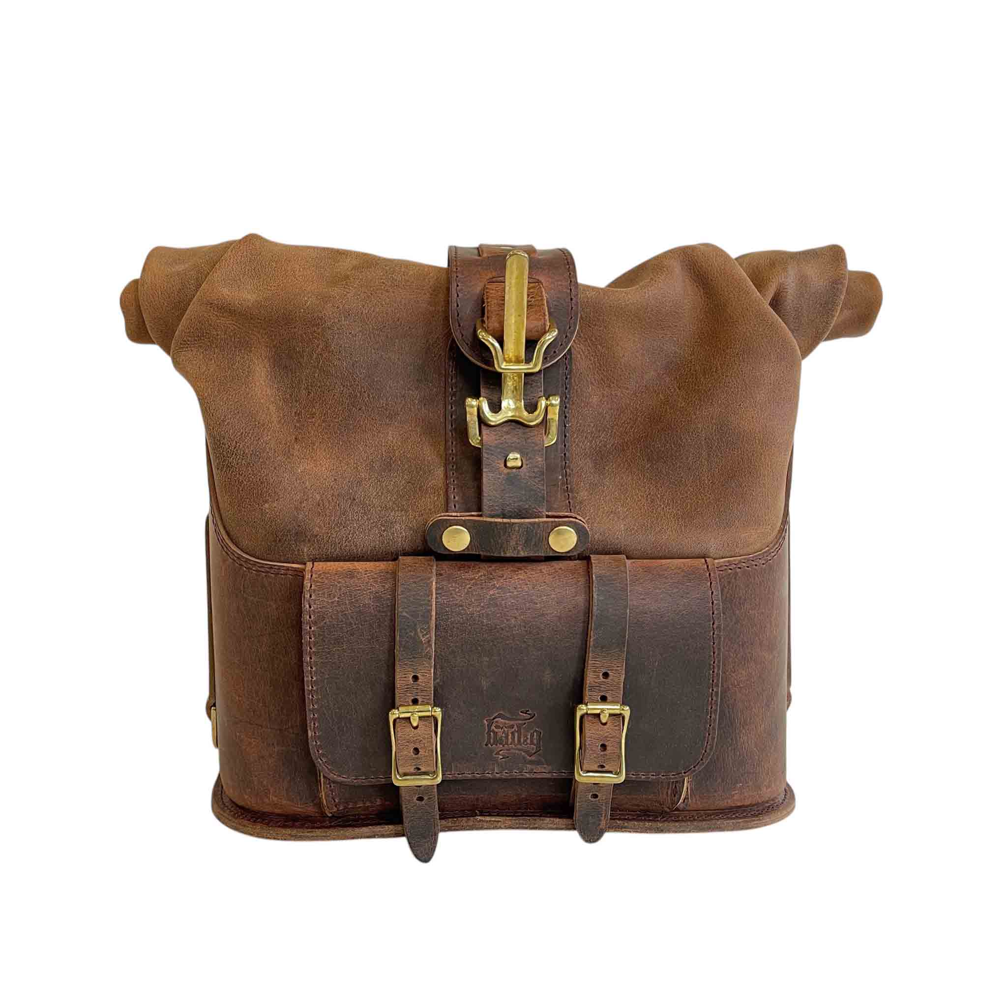 Triumph Bonneville Bobber Panniers Rolltop Swingarm Saddlebags. Hand crafted in USA with premium veg tan water buffalo leather, waterproof liners and solid brass hardware. BAD&G Customs TBP01