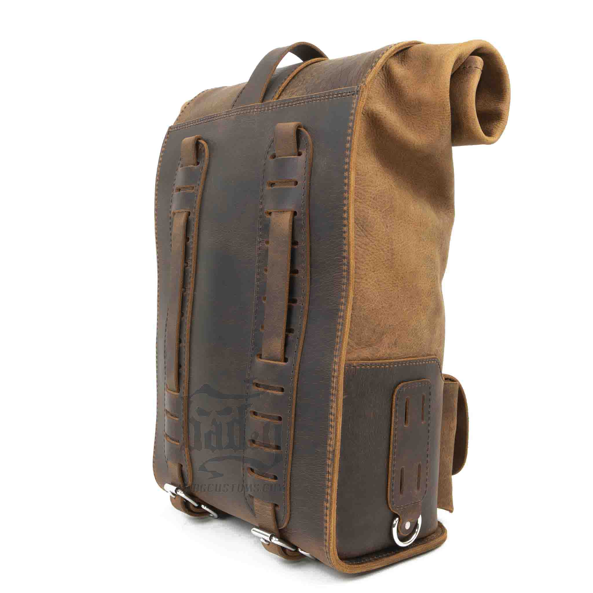 Upgrade your ride with the URB01 Rolltop Backpack Saddlebag. Unique design enables quick conversion from saddlebag to backpack. Hand crafted in USA with premium veg tan water buffalo leather and stainless steel hardware. Durable and stylish, it's the perfect fit for your motorcycle.