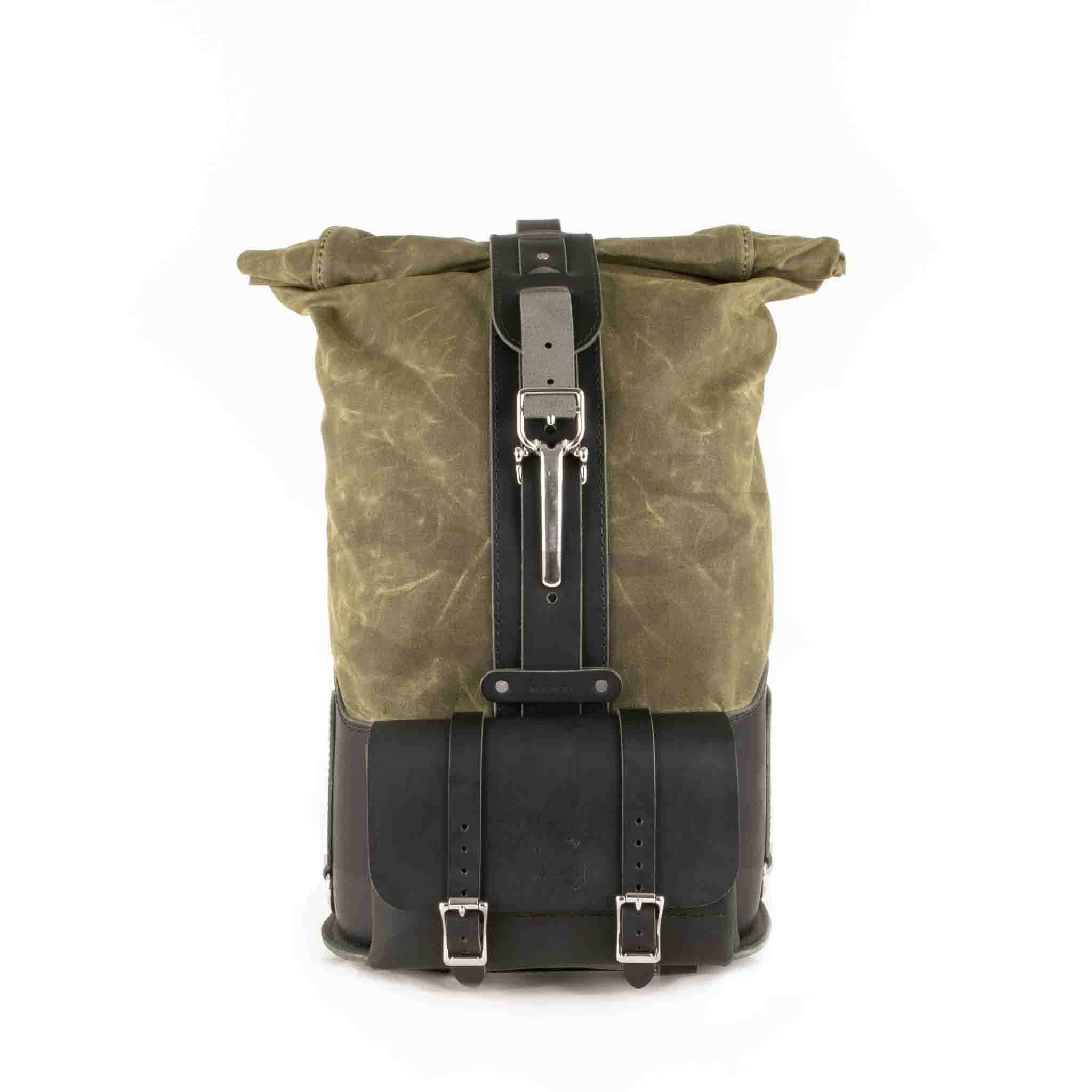 Upgrade your ride with the URB02 Rolltop Backpack Saddlebag. Unique design enables quick conversion from saddlebag to backpack. Hand crafted in USA with premium veg tan water buffalo leather, waxed canvas and stainless steel hardware. Durable and stylish, it's the perfect fit for your motorcycle.