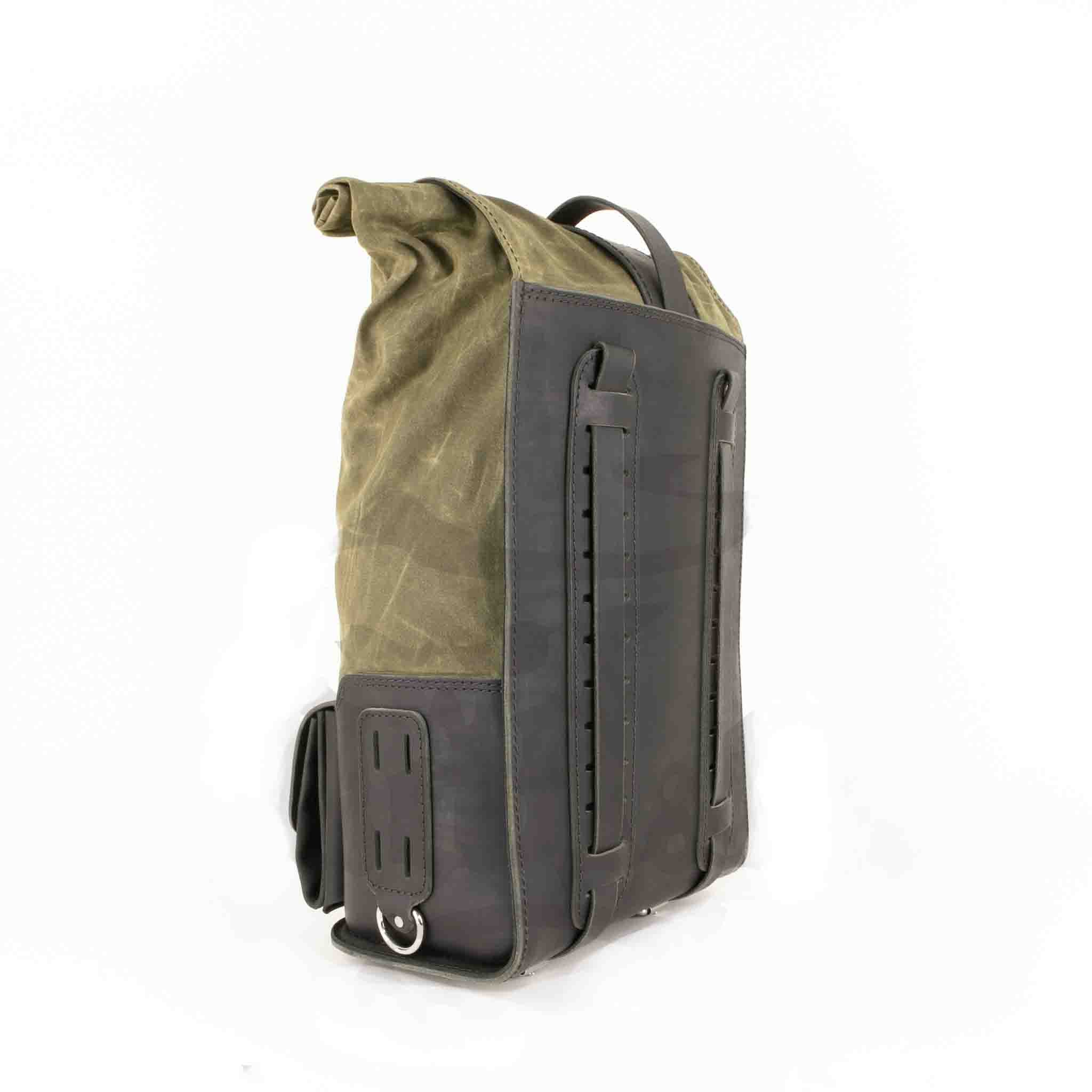 Upgrade your ride with the URB02 Rolltop Backpack Saddlebag. Unique design enables quick conversion from saddlebag to backpack. Hand crafted in USA with premium veg tan water buffalo leather, waxed canvas and stainless steel hardware. Durable and stylish, it's the perfect fit for your motorcycle.