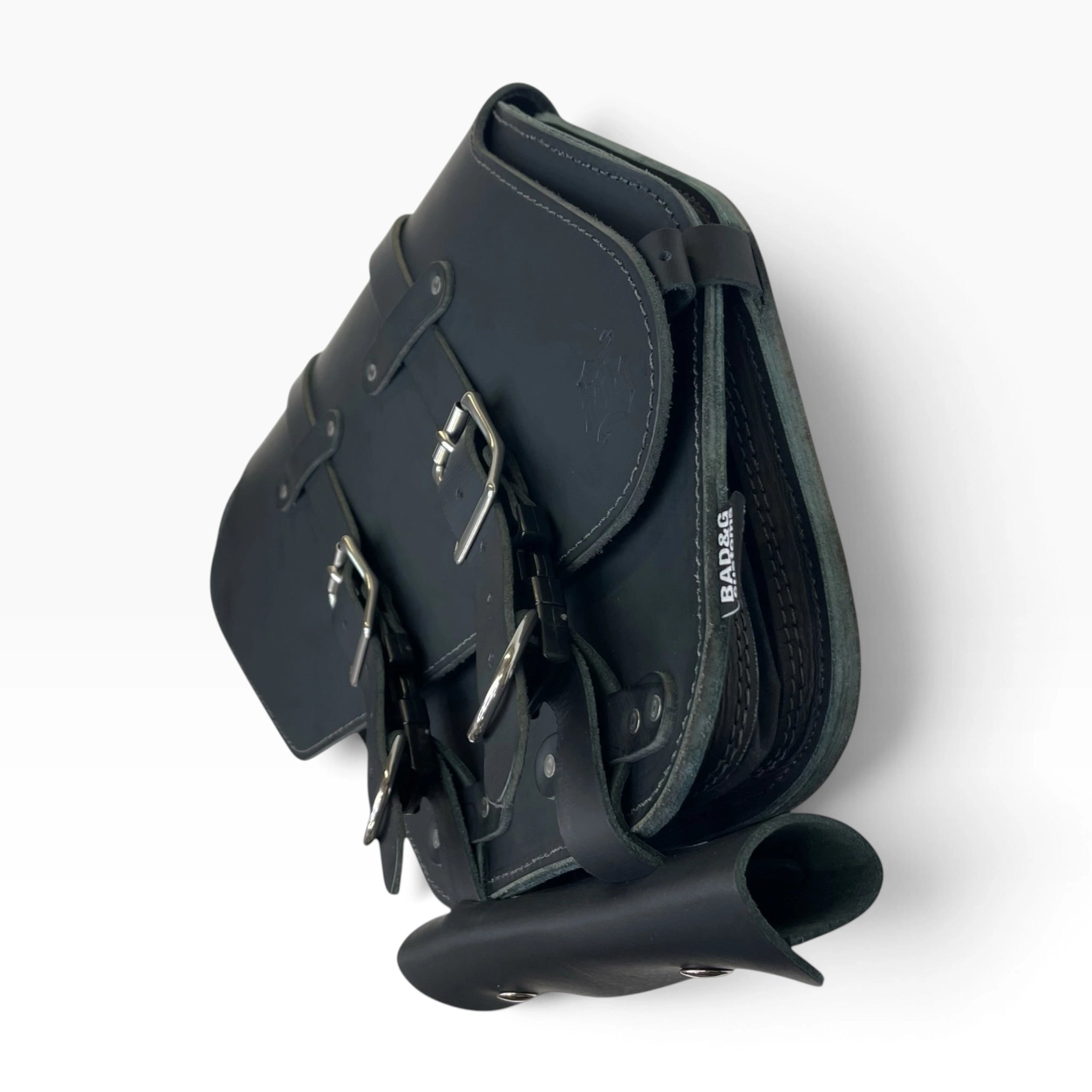 Black leather saddle bag with adjustable buckle straps and silver metal hardware, shown on a clean white background.