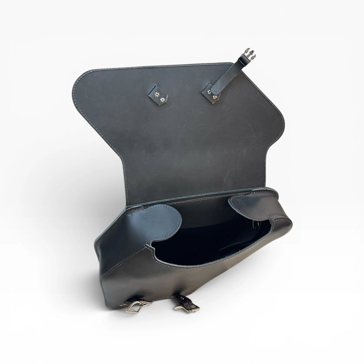 A dark gray leather clutch bag shown open, displaying its interior compartments, strap attachments, and silver-tone metal hardware against a clean white background.